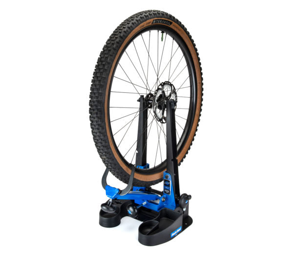 Park Tool TS-2.3 wheel truing stand holding a mountain bike wheel