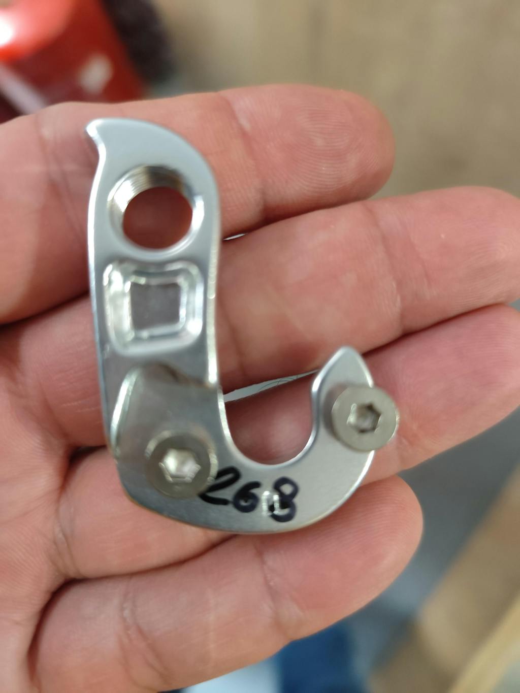 Silver model 268 CNC derailleur hanger with mounting hardware