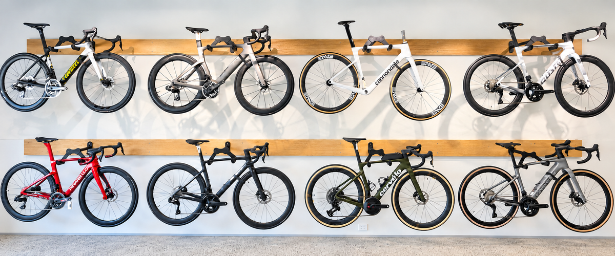 Premium road bikes displayed on the bike wall at The Odd Spoke in Dural