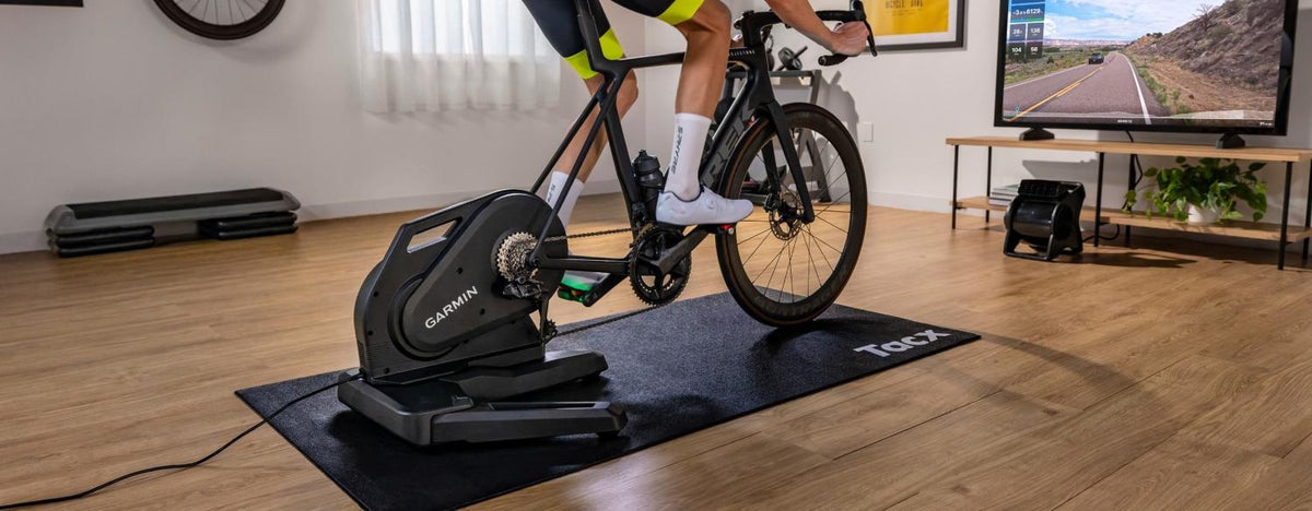 Tacx Nēra indoor smart trainer in use with a road bike